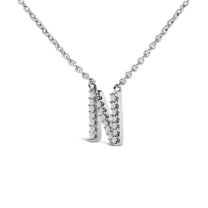 Close-up, front view of a white metal necklace with a pendant featuring three vertical bars set with small round white gemstones in a micro-pave setting, shown on a white background.