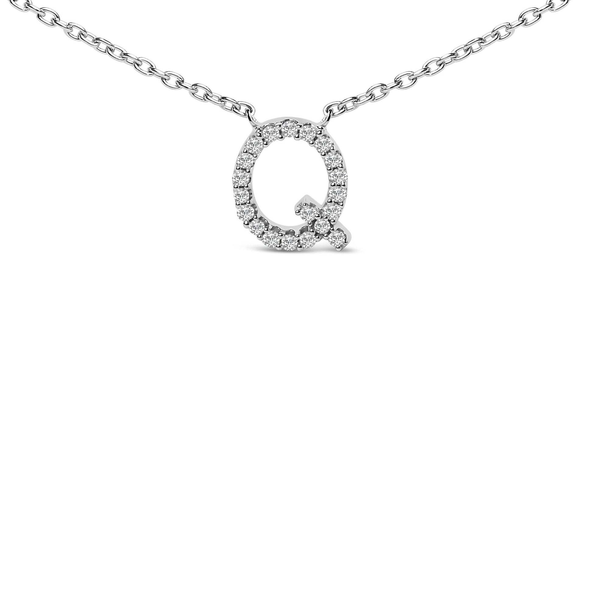 Close-up front view of a white metal necklace with a pendant shaped like the letter Q, outlined with round white gemstones in a micro-pave setting.