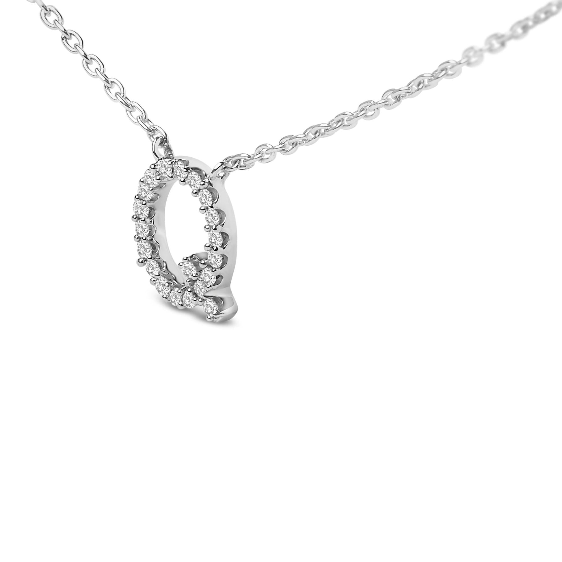 Close-up front angle shot of a white necklace featuring an oval pendant outlined with small round white gemstones in a micro-pave setting.