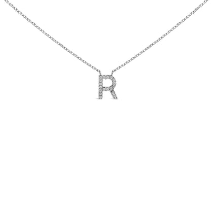 White necklace with a pendant in the shape of the letter R adorned with round white gemstones in a micro-pave setting, shown in a close-up front view on a white background.