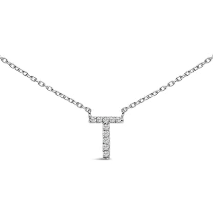 Close-up front view of a white metal necklace with a T-shaped pendant featuring round white gemstones in a micro-pave setting.
