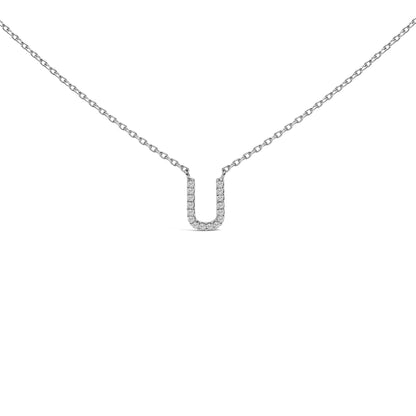Close-up front view of a white necklace with a U-shaped pendant featuring micro-pave white gemstones, shown on a white background.