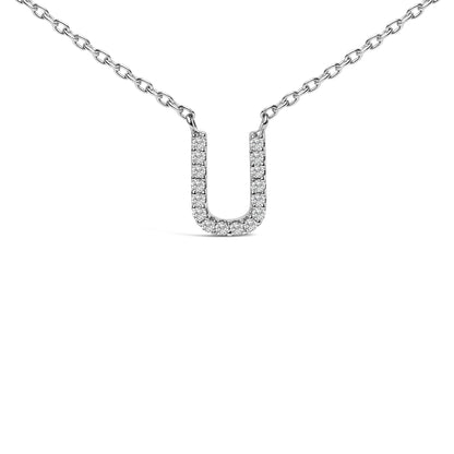 Close-up front angle of a white metal necklace with a U-shaped pendant featuring round white gemstones in a micro-pave setting.