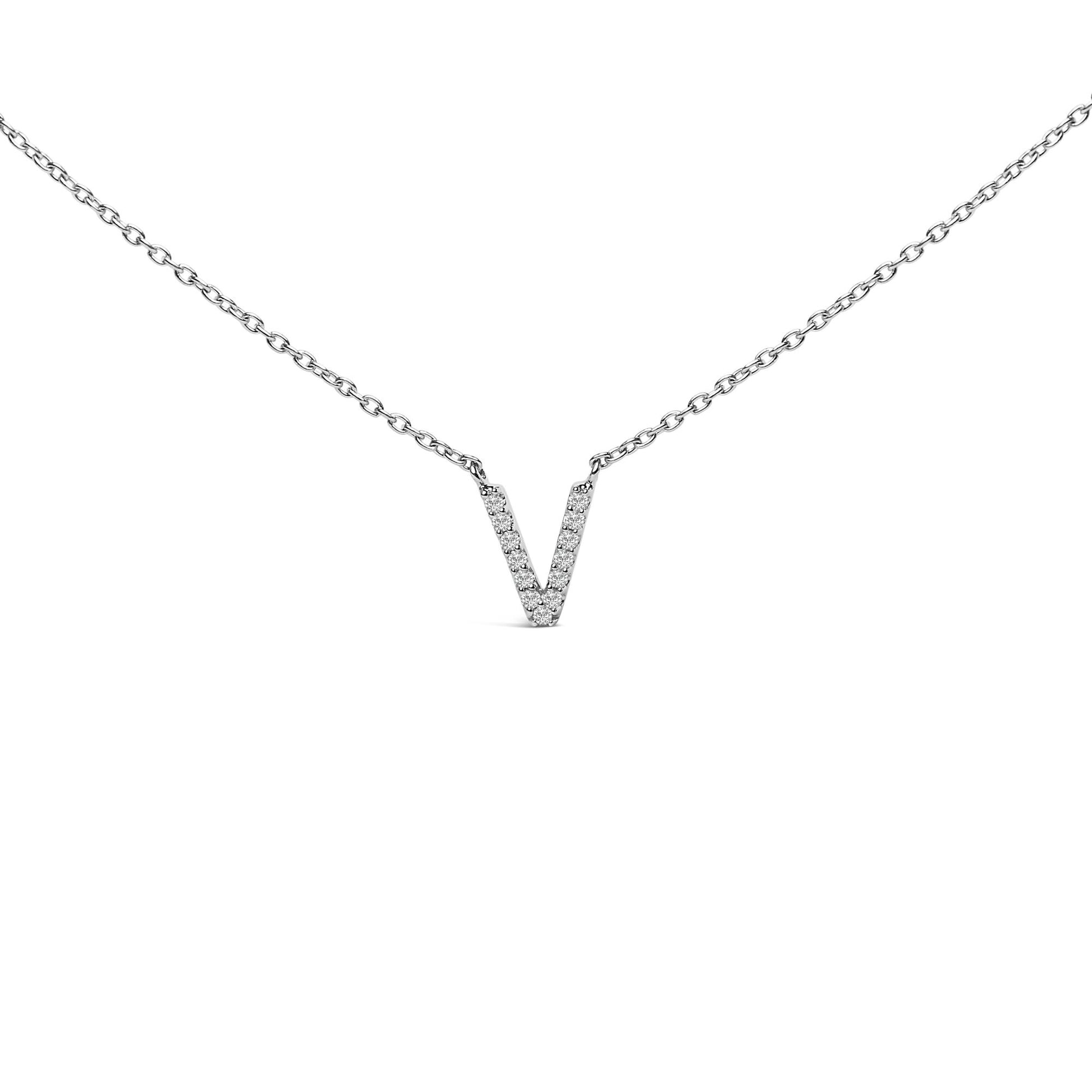 Close-up front view of a white metal necklace with a V-shaped pendant featuring micro-pave set round white gemstones, displayed on a white background.