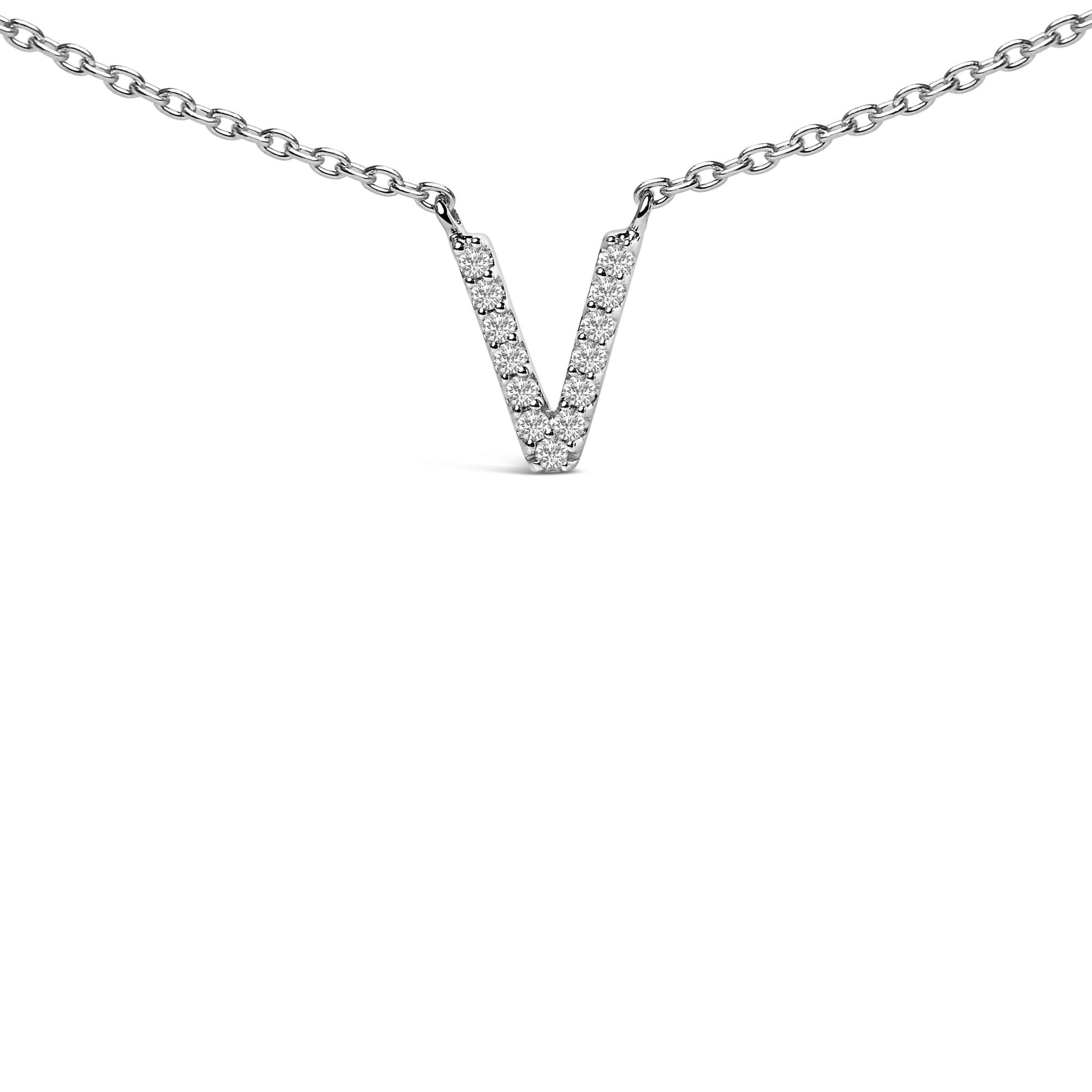Close-up front view of a white necklace with a V-shaped pendant featuring round white gemstones in a micro-pave setting, shown on a white background.