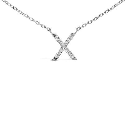 Close-up front view of a white metal necklace with an X-shaped pendant featuring round white gemstones in a micro-pave setting, shown on a white background.