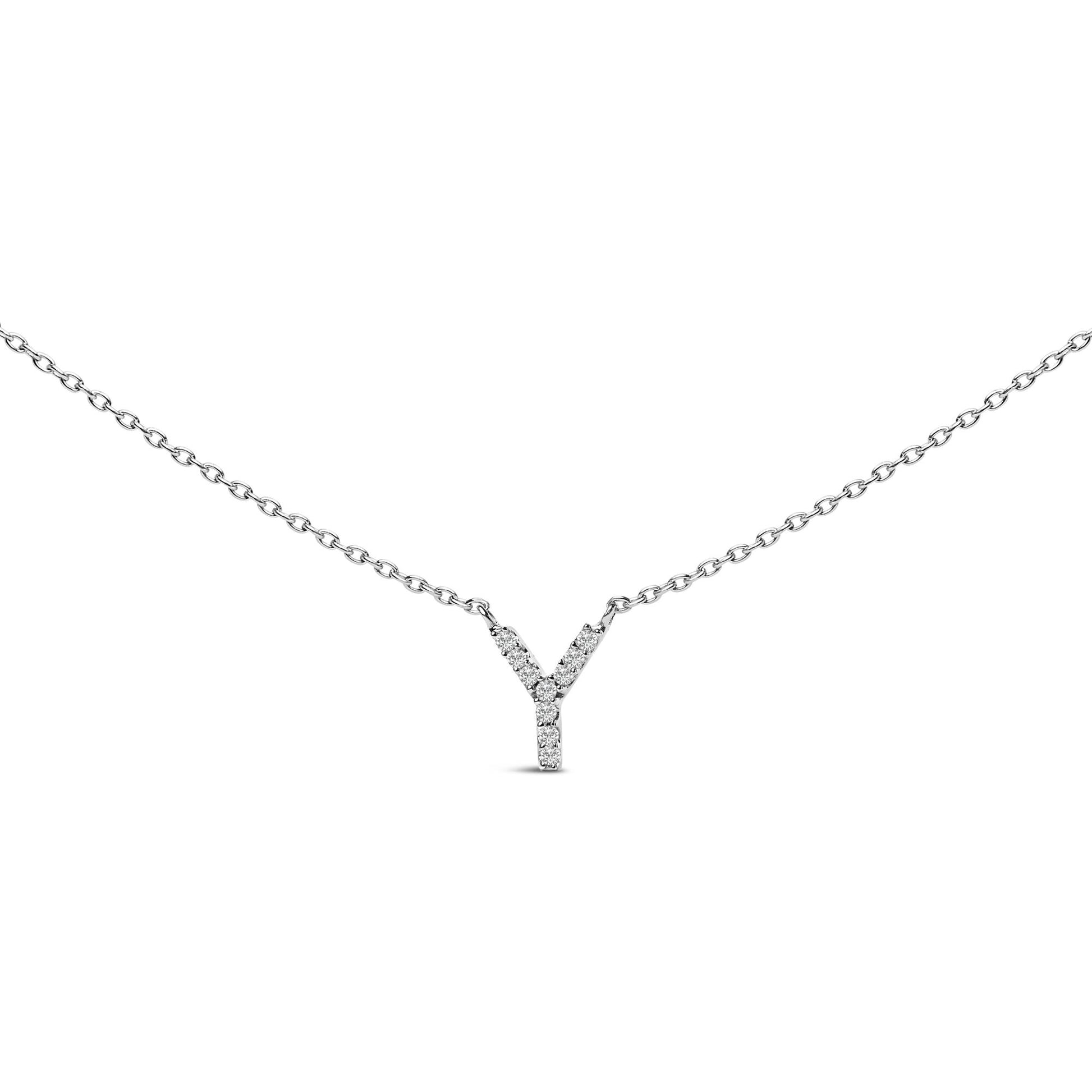 Close-up front angle of a white necklace with a Y-shaped pendant adorned with small round white gemstones in a micro-pave setting shown on a white background.