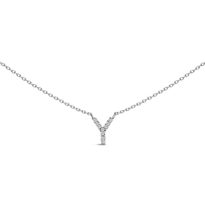 Close-up front angle of a white necklace with a Y-shaped pendant adorned with small round white gemstones in a micro-pave setting shown on a white background.