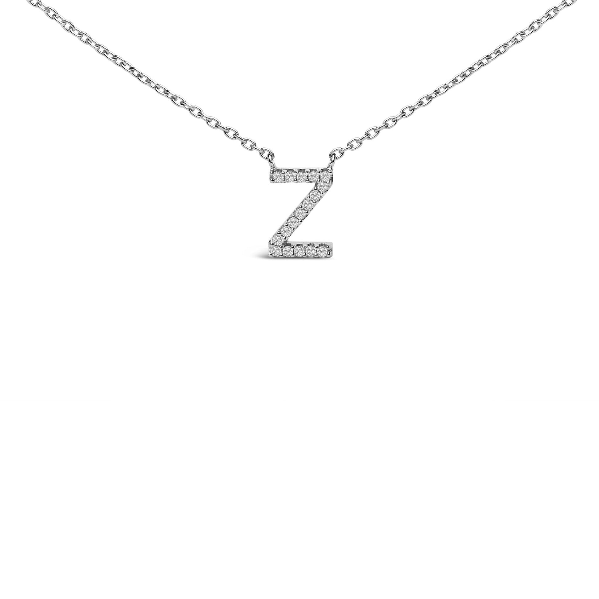 Close-up front view of a white metal necklace with a pendant in the shape of the letter 'Z' adorned with multiple round white gemstones in a micro-pave setting.