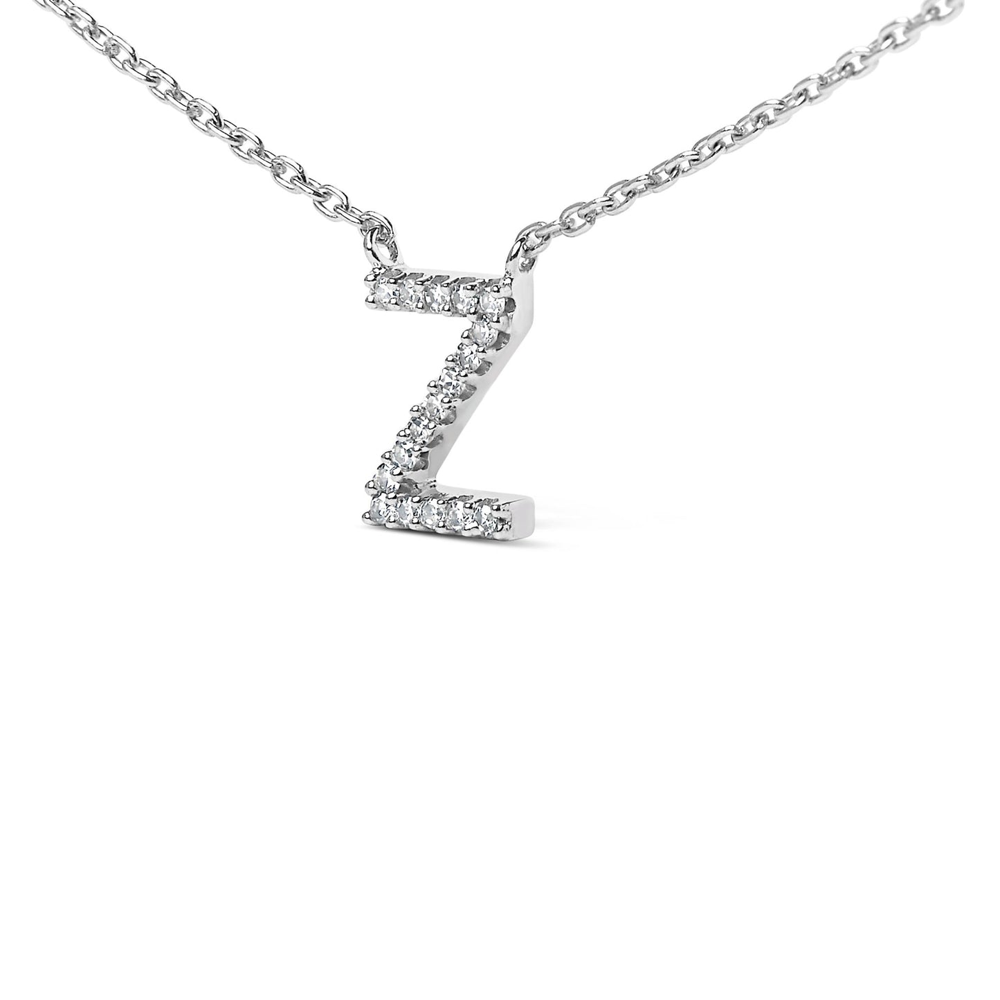 Close-up front view of a white necklace pendant shaped like the letter Z, adorned with multiple round white gemstones in a micro-pave setting on a white chain, shown on a white background.