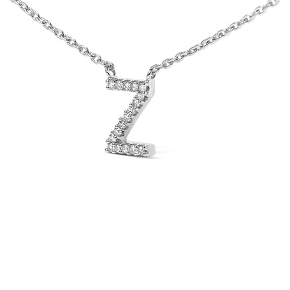 Close-up front view of a white necklace pendant shaped like the letter Z, adorned with multiple round white gemstones in a micro-pave setting on a white chain, shown on a white background.