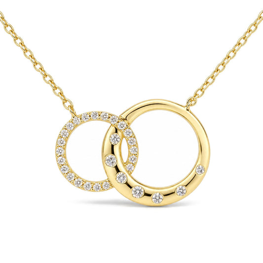 Close-up front view of a yellow metal necklace featuring two interlocking circular pendants, one adorned with small white gemstones in prong setting and the other with evenly spaced white gemstones.