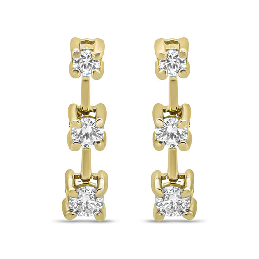 Front-facing view of yellow metal earrings featuring a vertical row of three prong-set white round gemstones.
