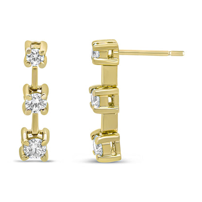 Yellow metal earrings with three vertically aligned round white gemstones in prong settings, shown from front and side angles.