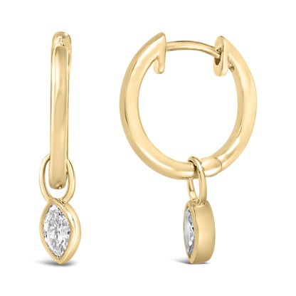 Close-up front and side view of yellow metal hoop earrings with dangling marquise-shaped white gemstones in bezel settings.