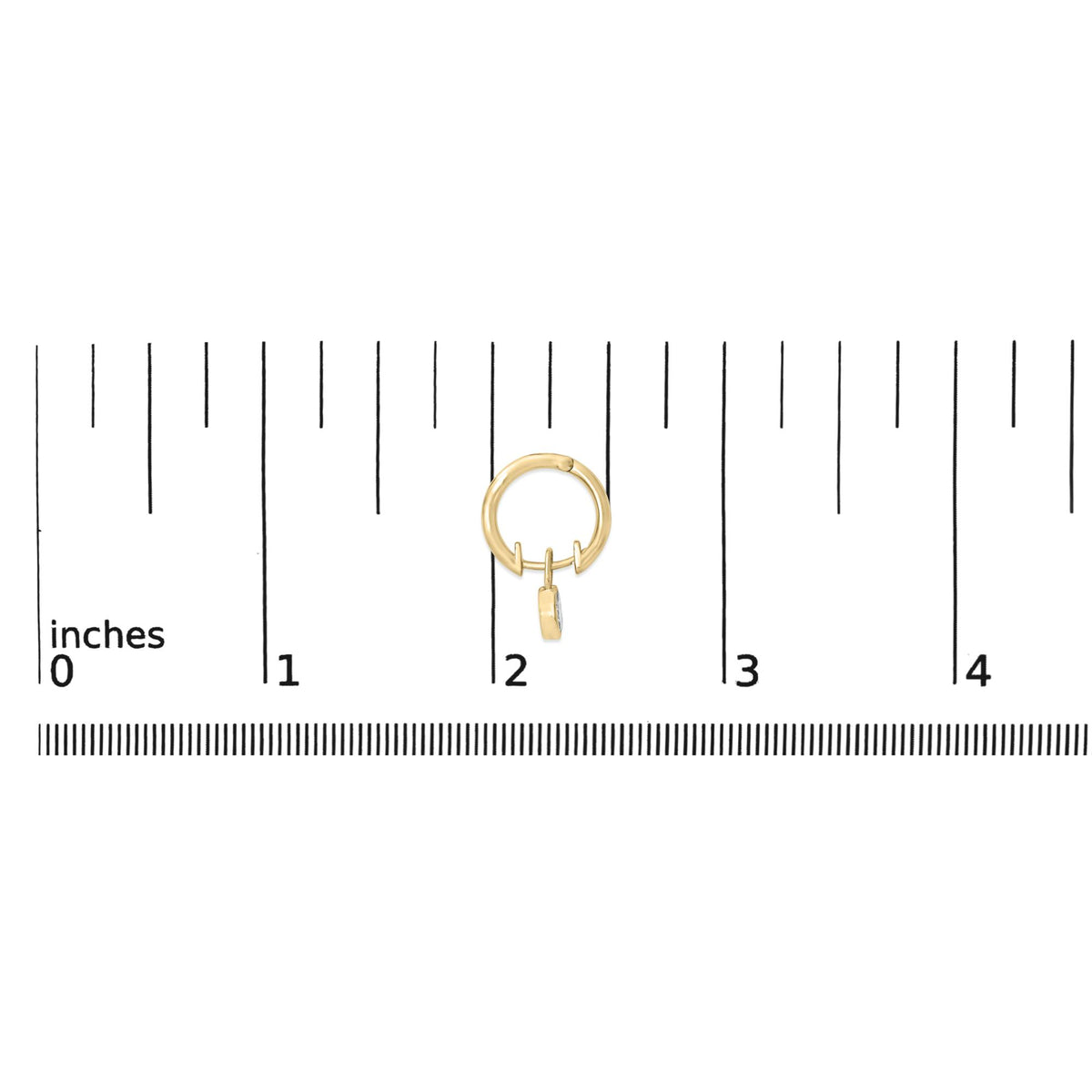 Close-up front view of a yellow metal hoop earring with a small dangling charm featuring two white marquise-shaped gemstones in bezel settings, shown on a ruler scale.