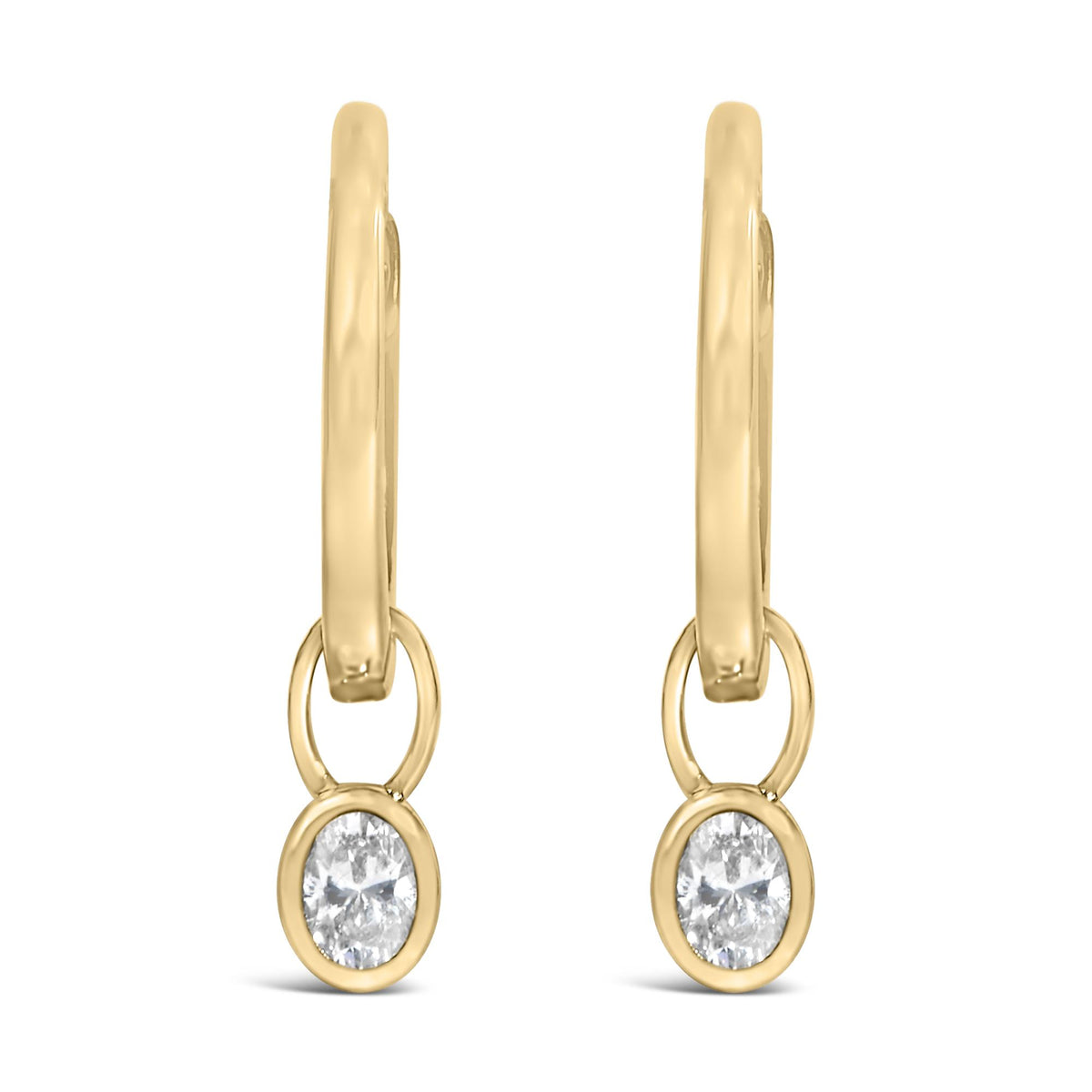 Front view of yellow metal drop earrings with oval-shaped white gemstones in bezel settings.