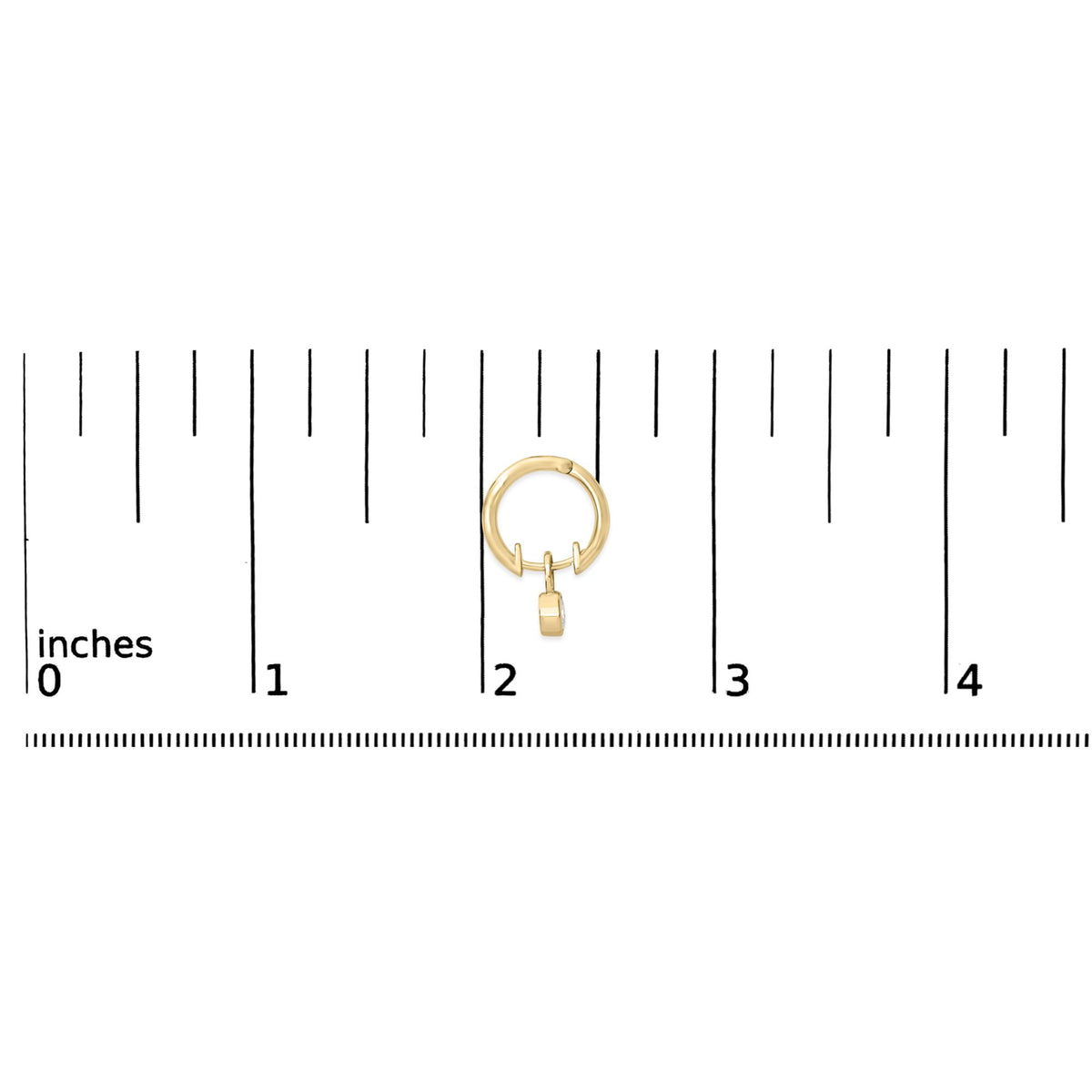 Close-up front view of a yellow metal hoop earring with a hanging oval-shaped white gemstone in bezel setting, shown on a ruler scale.
