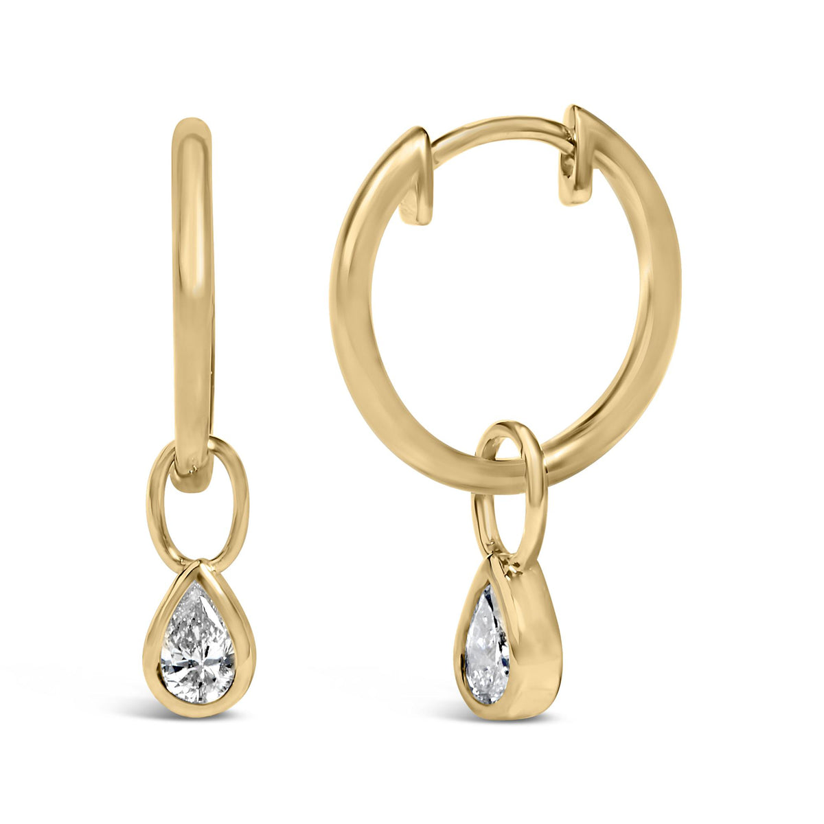 Close-up front and side angle of yellow metal hoop earrings with small circular link and pear-shaped white gemstones in bezel settings hanging from the link.