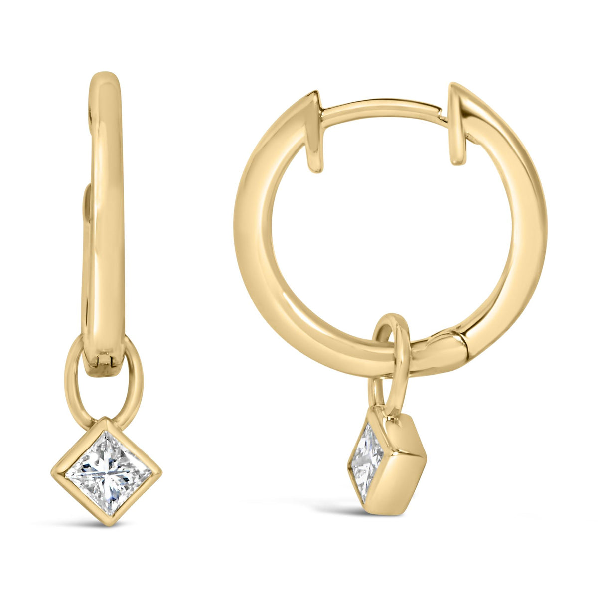 Close-up front and side view of yellow metal hoop earrings with a dangling princess-shaped white gemstone in a bezel setting.