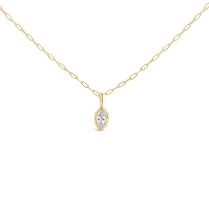 Close-up front view of a yellow metal necklace with a chain link design and a marquise-shaped white gemstone in a bezel setting pendant.