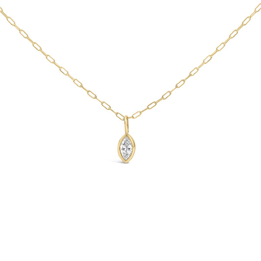 Close-up front view of a yellow metal necklace with a chain link design and a marquise-shaped white gemstone in a bezel setting pendant.