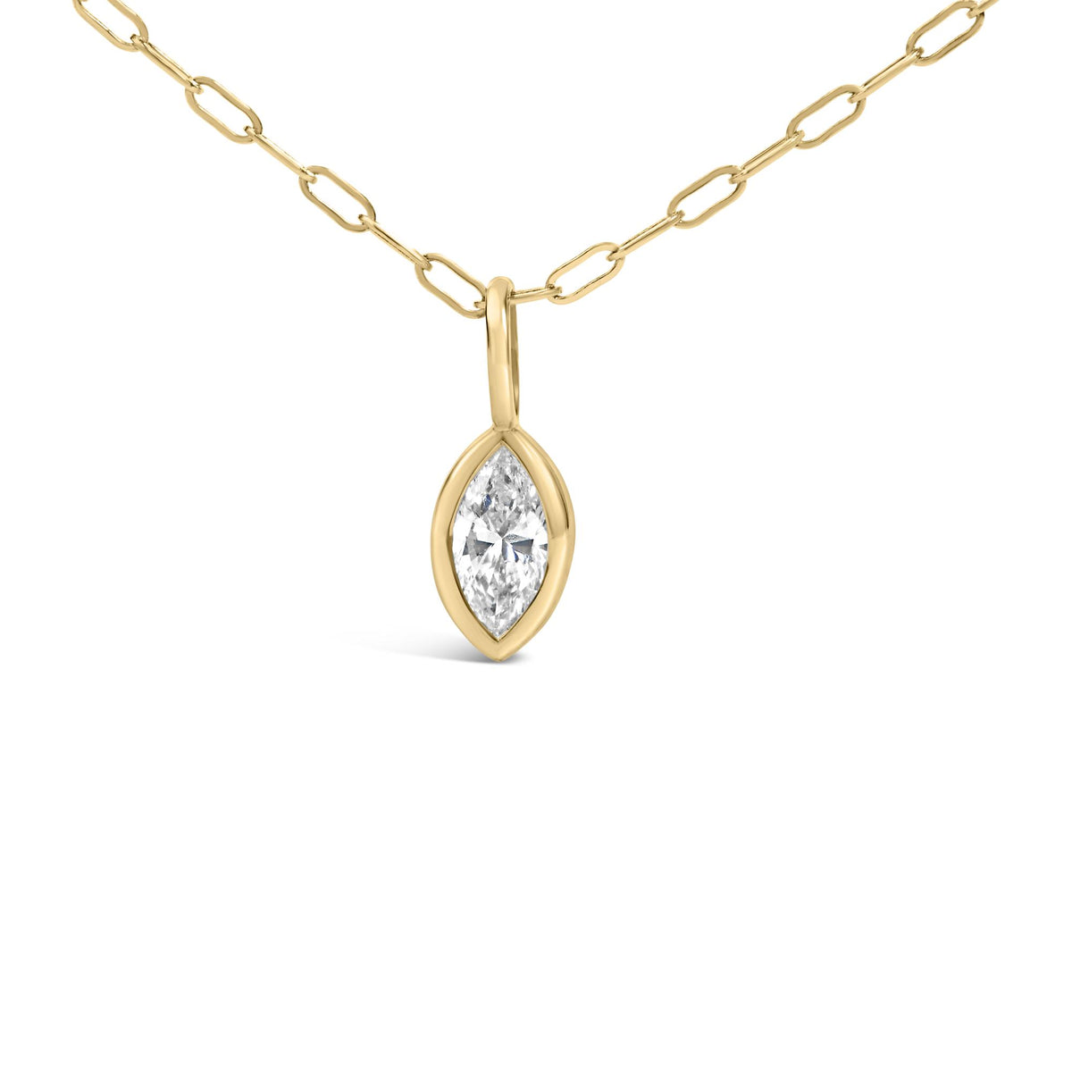 Close-up front view of a yellow metal necklace chain with a bezel-set marquise-shaped white gemstone pendant.