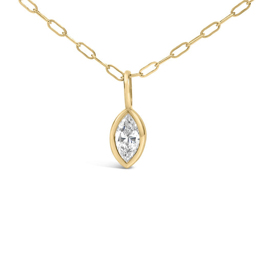 Close-up front view of a yellow metal necklace chain with a bezel-set marquise-shaped white gemstone pendant.