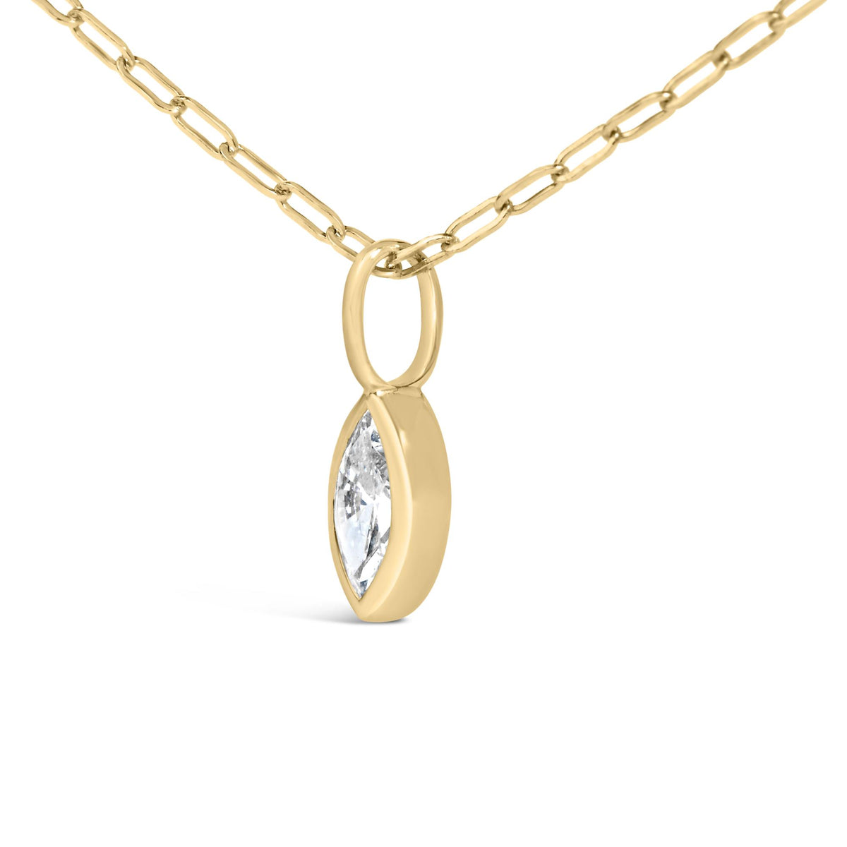 Close-up front angle of a yellow necklace chain with a marquise-shaped white gemstone in a bezel setting pendant.