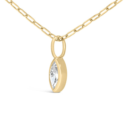 Close-up front angle of a yellow necklace chain with a marquise-shaped white gemstone in a bezel setting pendant.