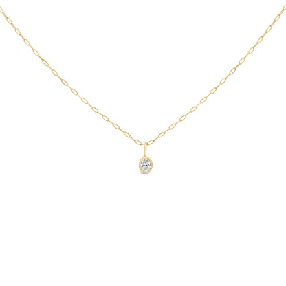 Close-up front view of a yellow necklace chain with an oval white gemstone pendant in a bezel setting.