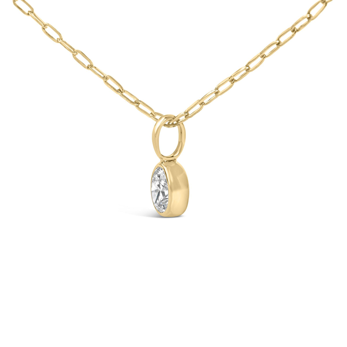 Front view of 14K yellow gold oval diamond bezel-set solitaire pendant necklace showcasing paperclip chain with white background