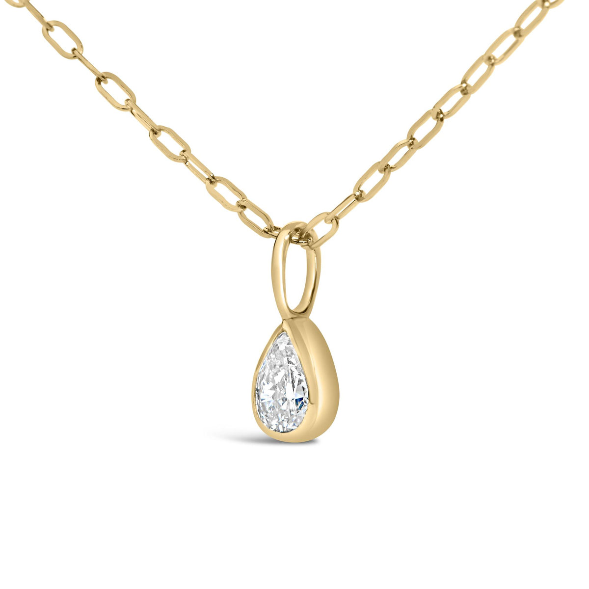 Close-up front view of a yellow metal necklace with oval-shaped chain links and a pear-shaped white gemstone in a bezel setting pendant.