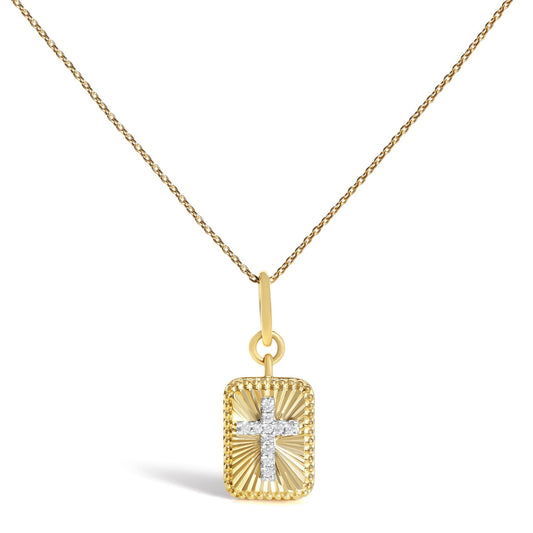 Front view of 10K yellow gold diamond accent cross fluted medallion pendant necklace on white background