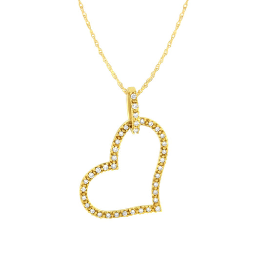 Close-up front angle of a yellow metal heart-shaped necklace pendant with round prong-set brownish gemstones along the outline and bail.