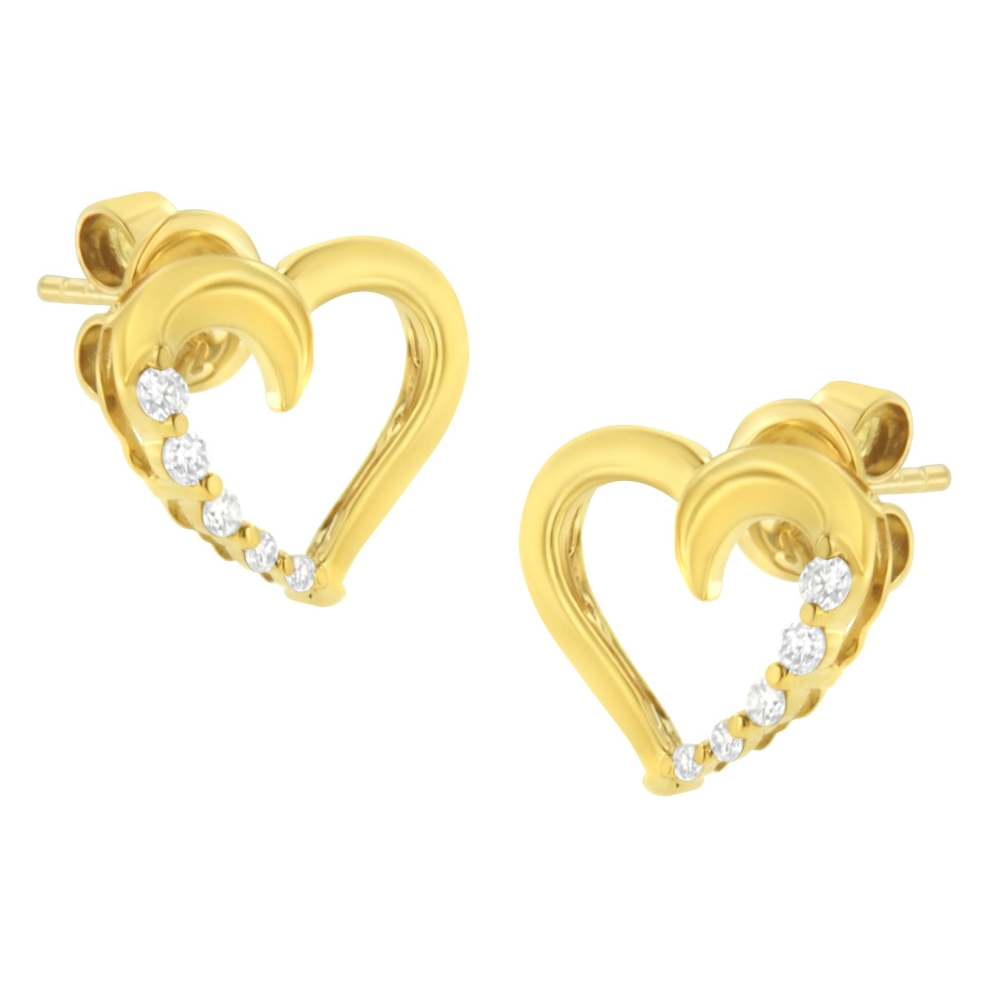 Pair of yellow earrings in heart shape with prong-set white gemstones along one side, shown from front angle.