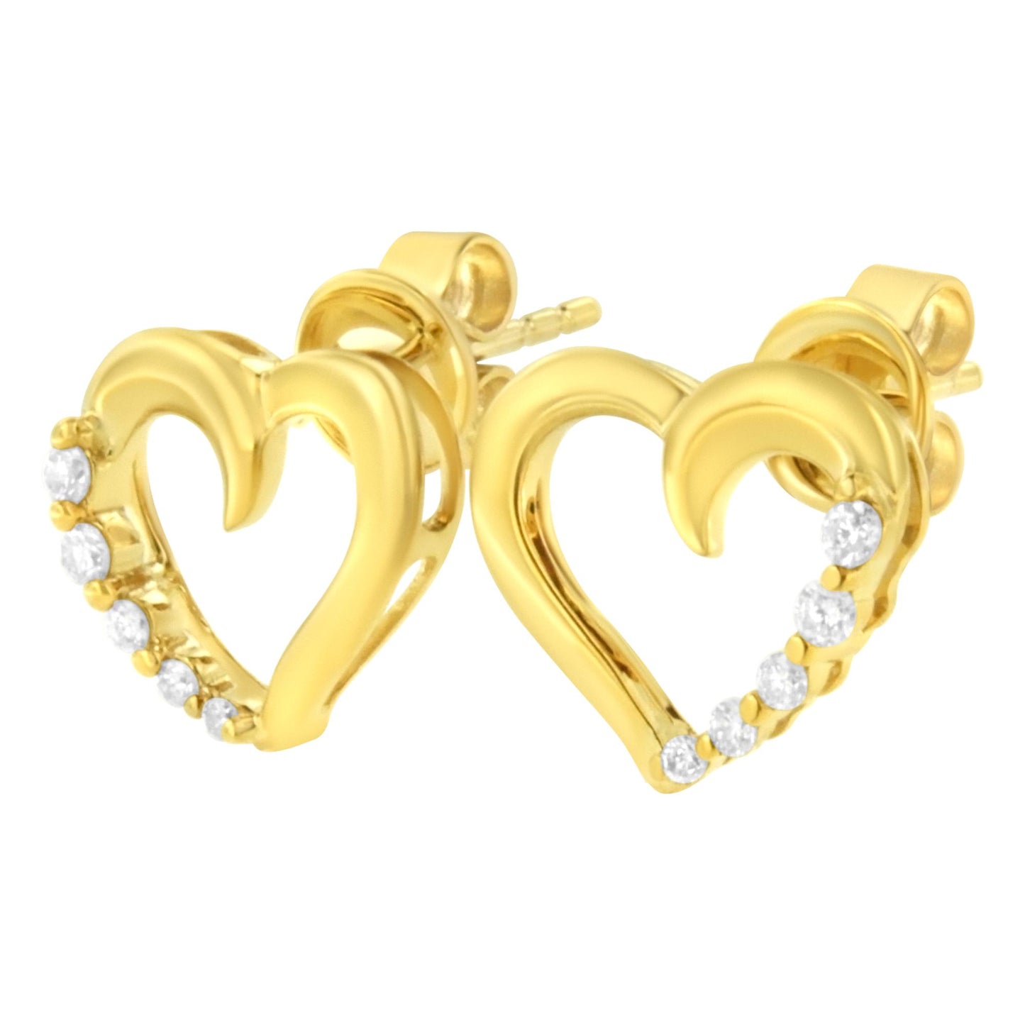 Close-up front angle of yellow metal heart-shaped earrings with five small white gemstones prong-set along one side.