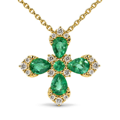 Close-up front view of a yellow metal necklace with a cross-shaped pendant featuring pear-shaped green gemstones surrounded by round white gemstones, shown on a white background.