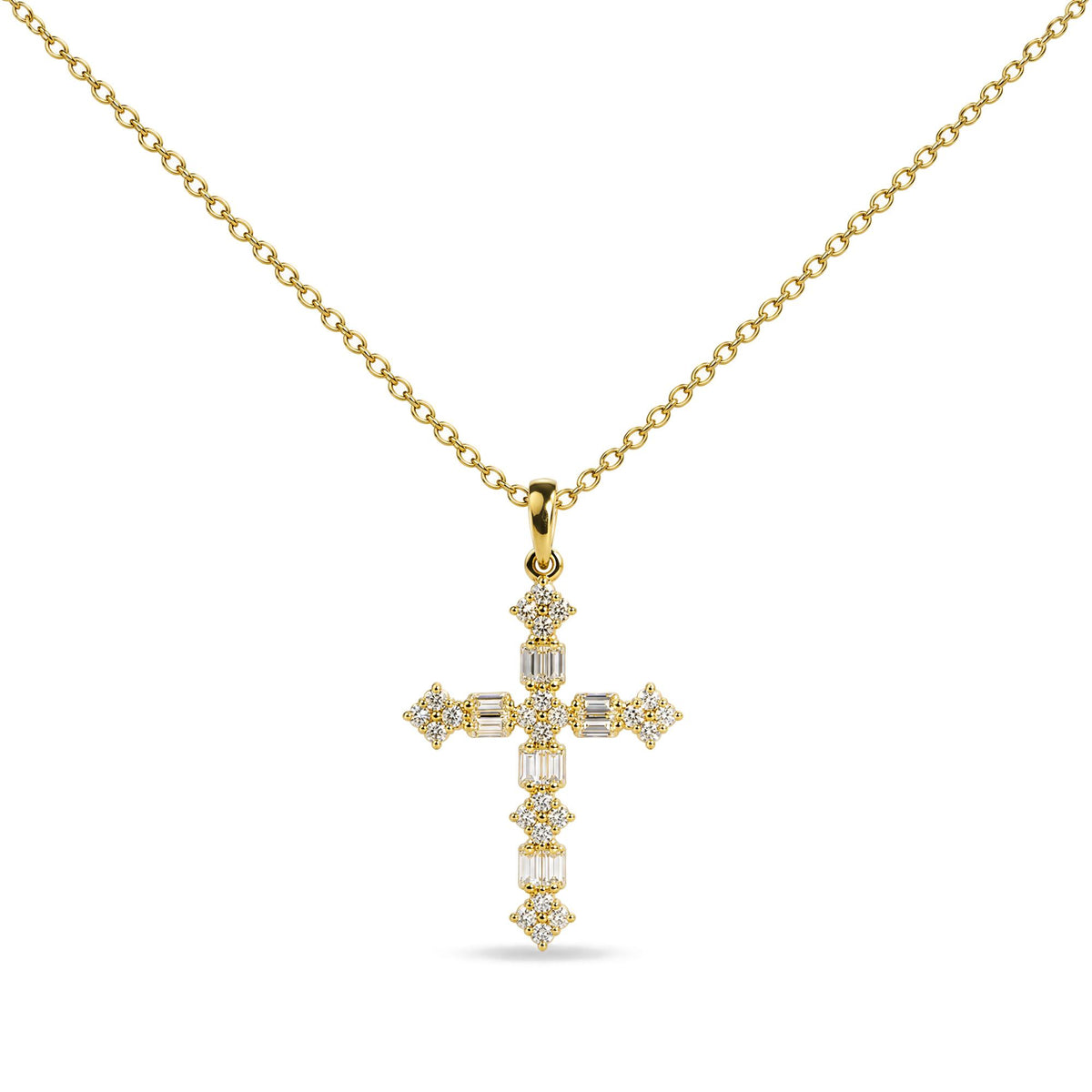 Close-up front view of a yellow necklace with a cross-shaped pendant adorned with round and baguette white gemstones.