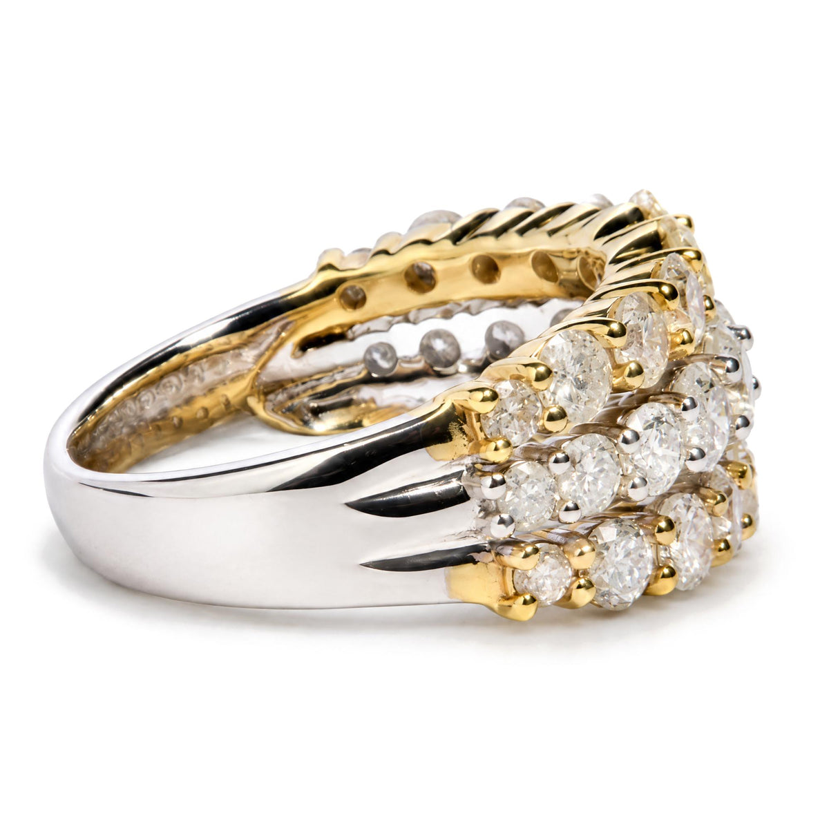 Close-up of a jewelry ring shown at an angled side view featuring intertwined yellow and white metal bands with multiple round white gemstones in prong settings.
