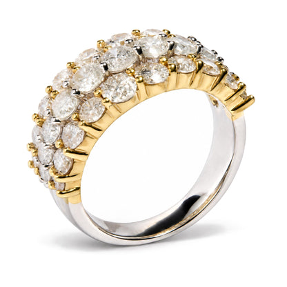 Close-up front angle of a two-tone ring featuring multiple round white gemstones in prong settings on the upper half of the band.