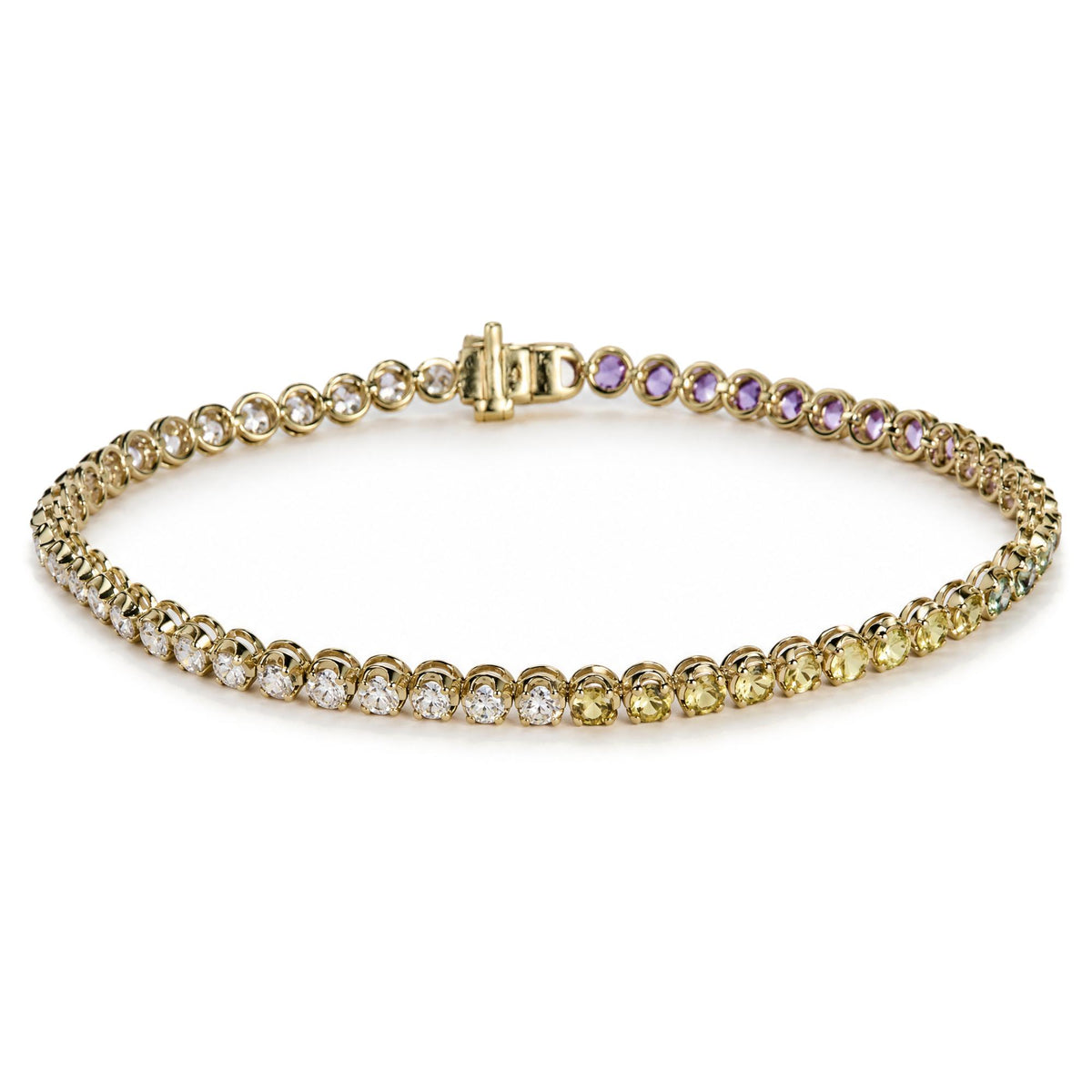 Close-up image of a yellow metal bracelet with round white gemstones and multicolored round gemstones in prong settings, shown laid flat in a partial circle from a top angle.