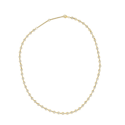 Close-up top view of a yellow metal necklace with round white gemstones in bezel settings along the chain, shown on a white background.