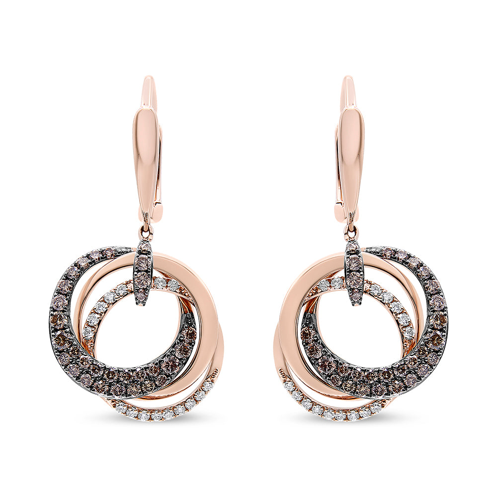 Front view of rose metal earrings with overlapping circular bands, adorned with white and brown round gemstones in prong and pave settings.