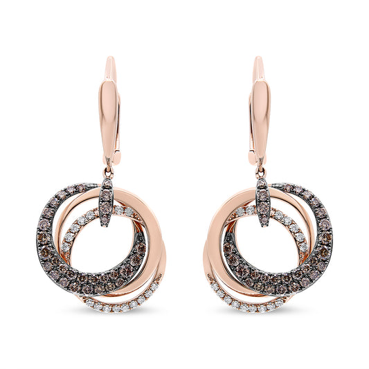 Front view of rose metal earrings with overlapping circular bands, adorned with white and brown round gemstones in prong and pave settings.