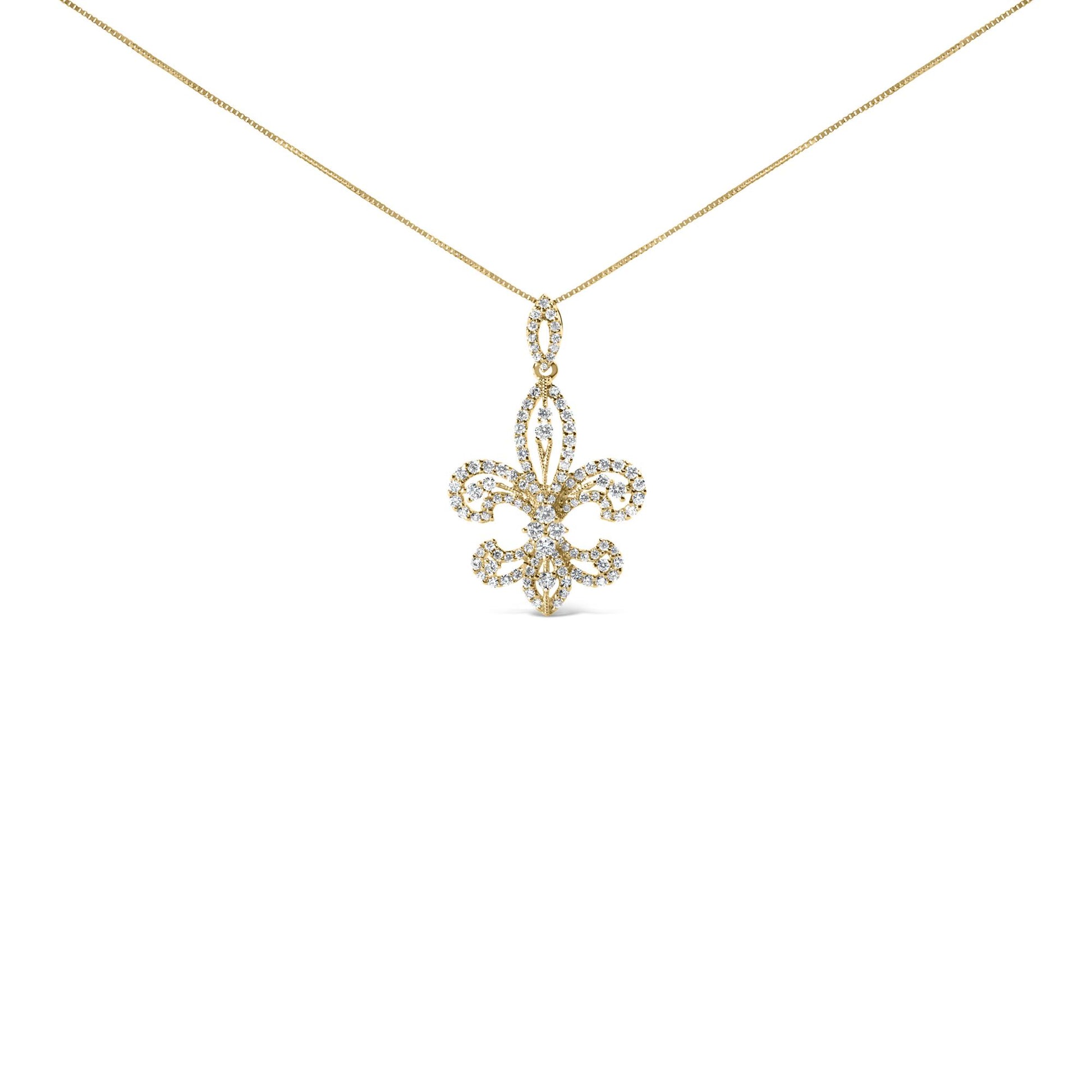 Front-facing shot of a yellow necklace with a fleur-de-lis pendant encrusted with multiple white round gemstones in prong settings, hanging from a fine yellow chain.