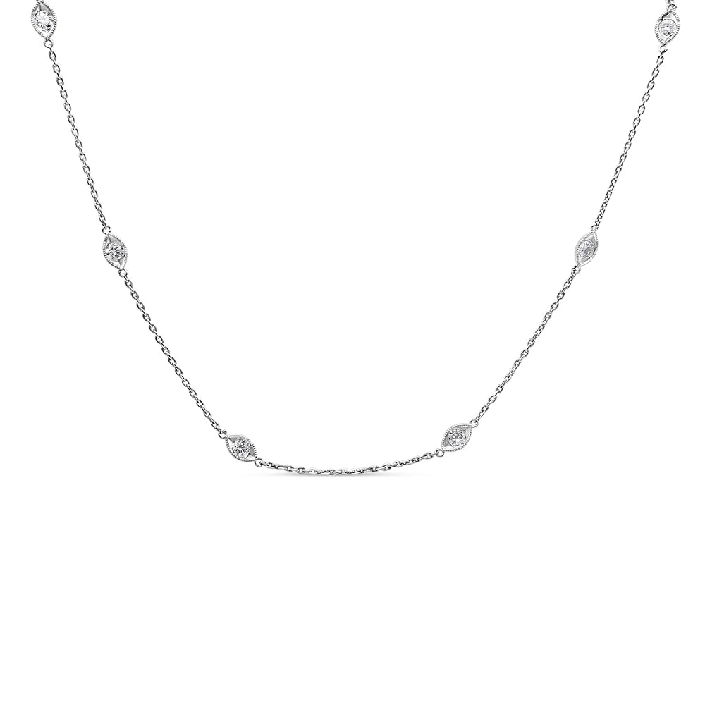 Front angled view of a white metal chain necklace with multiple round white gemstones set in bezel settings evenly spaced along the chain.