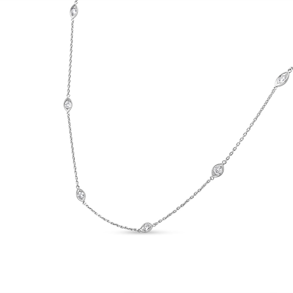 White metal necklace with round bezel-set white gemstones spaced along the chain, shown against a white background at a slight angle.