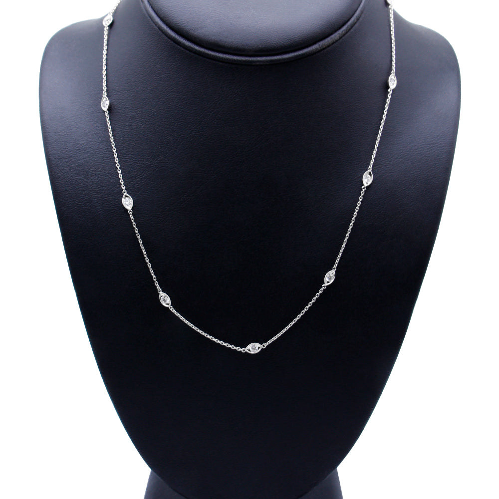 Front-facing image of a white metal necklace with round bezel-set white gemstones evenly spaced along the chain, displayed on a black necklace bust.