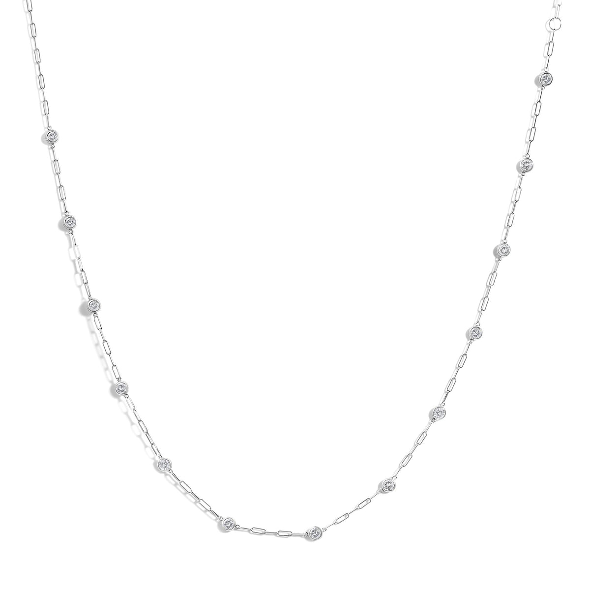 White necklace with elongated chain links and round white gemstones in bezel settings along the chain, shown from a top-down angle on a white background.